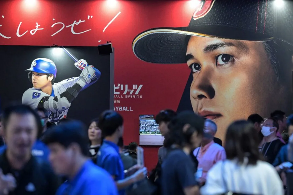 Images of Los Angeles Dodgers Japanese player Shohei Ohtani decorate the wall of a booth by Japanese game maker Konami, during the preview day for the annual Tokyo Game Show at Makuhari Messe in Chiba City, Chiba Prefecture on September 26, 2024.  Richard A. Brooks / AFP