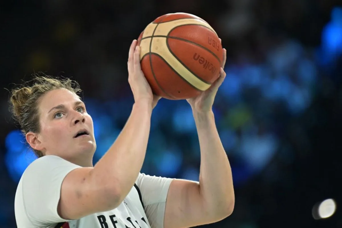 Belgium's #13 Kyara Linskens takes a free throw in the women's Bronze Medal basketball match between Belgium and Australia during the Paris 2024 Olympic Games at the Bercy  Arena in Paris on August 11, 2024.  Damien MEYER / AFP