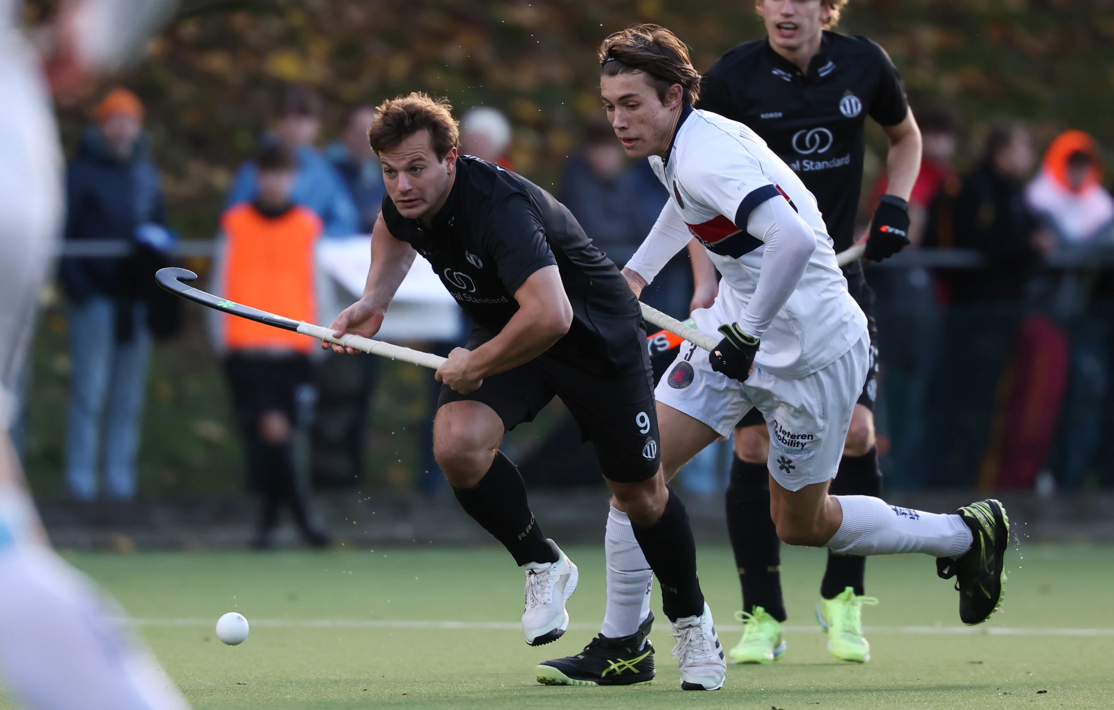 Racing's Maxime Plennevaux and Dragons' Olivier Vanderkeilen fight for the ball during a hockey game between Royal Racing Club and KHC Dragons, Sunday 17 November 2024 in Brussels, on day 12 of the Belgian first division hockey championship. BELGA PHOTO VIRGINIE LEFOUR