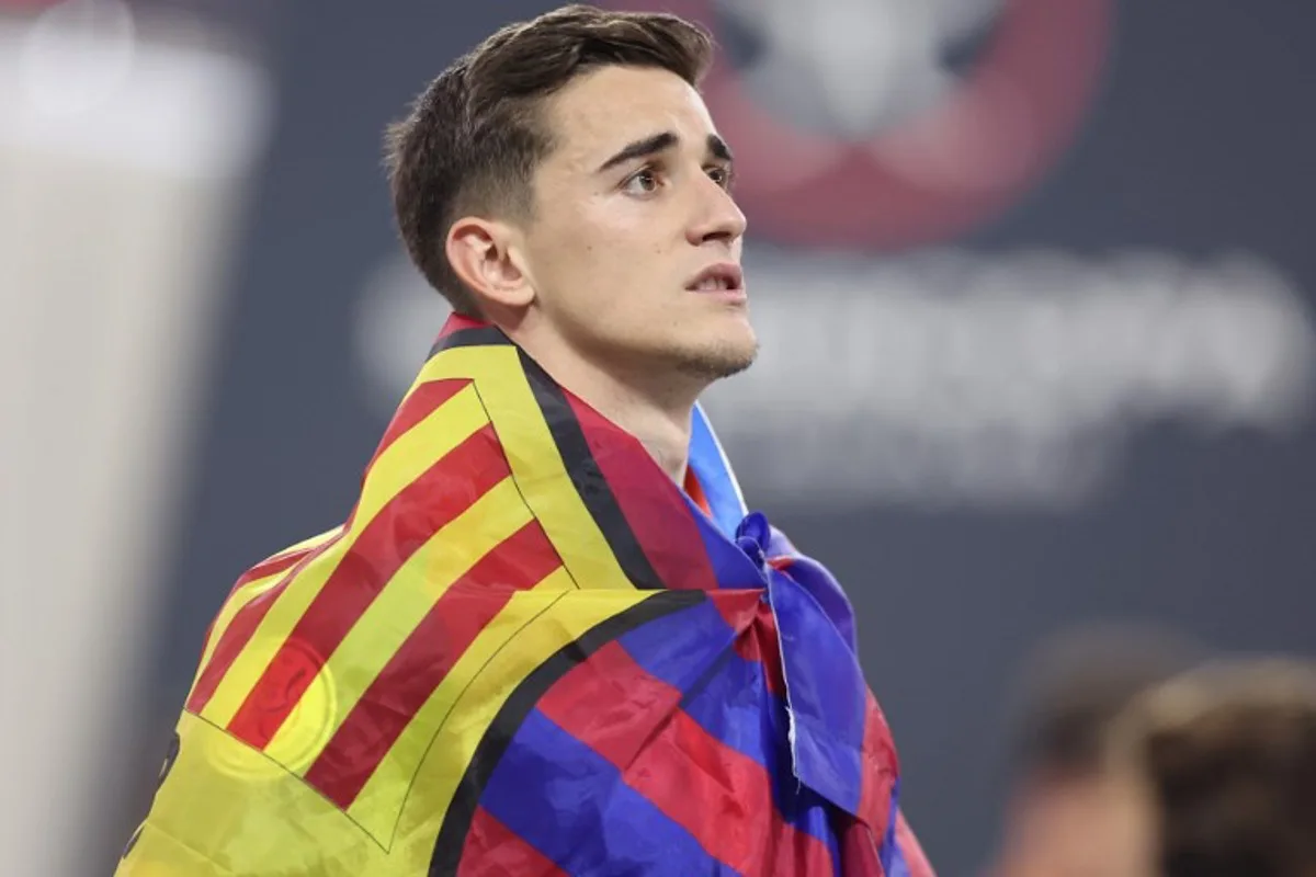 Barcelona's Spanish midfielder #6 Pablo Gavi watches after winning the Spanish Super Cup final football match between Real Madrid and Barcelona at the King Abdullah Sport City in Jeddah on January 12, 2025.  Haitham AL-SHUKAIRI / AFP