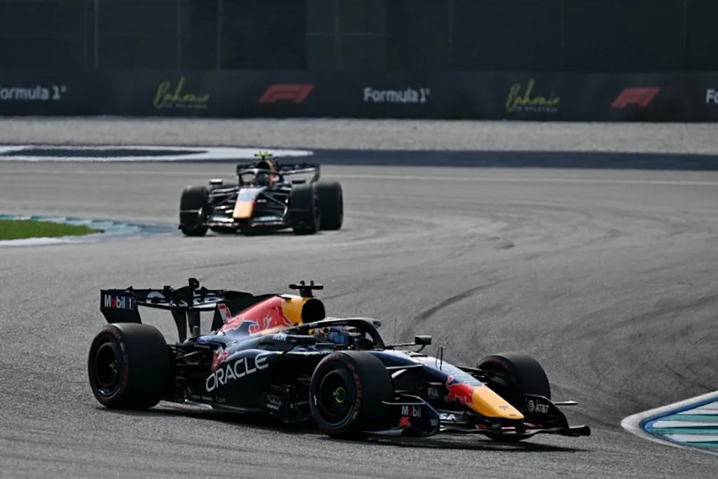 Red Bull Racing's Dutch driver Max Verstappen (front) and Red Bull Racing's French driver Isack Hadjar drive during the qualifying session of the Formula One Bahrain Grand Prix in Sepang on October 3, 2026.  Lillian SUWANRUMPHA / AFP