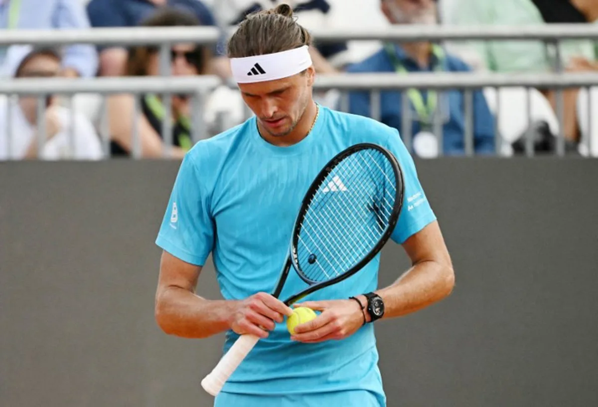 Germany's Alexander Zverev reacts during the match against Italy's Luciano Darderi during the ATP Rome Open tennis tournament at Foro Italico in Rome on May 12, 2026. Andreas SOLARO / AFP
