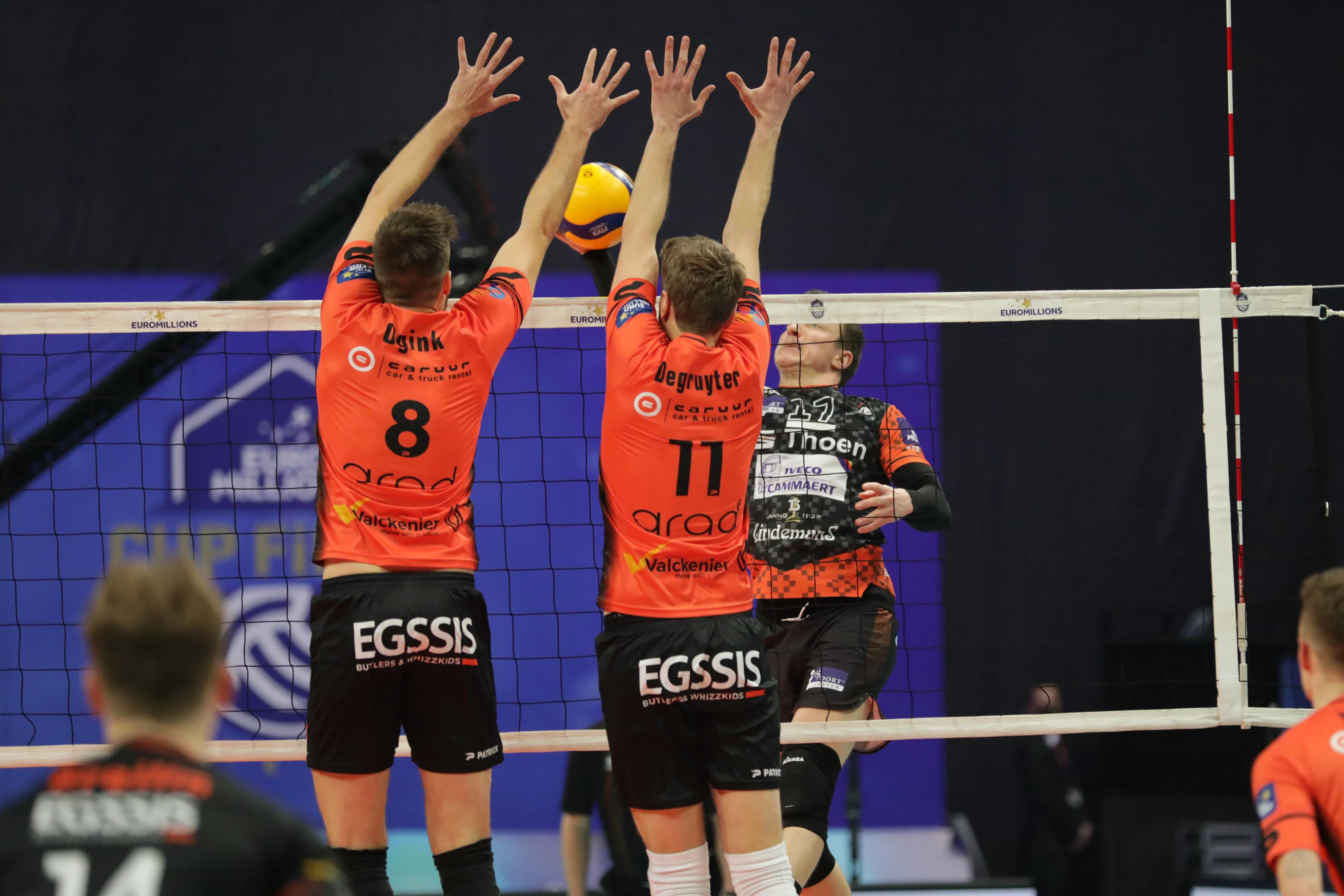 Gent's Chris Ogink and and 11 Gent's Tim Degruyter blocking the ball during the match between Caruur Volley Gent and Lindemans Aalst, the final match in the men Belgian volleyball cup competition, Sunday 27 February 2022 in Merksem, Antwerp. BELGA PHOTO MARIJN DE KEYZER