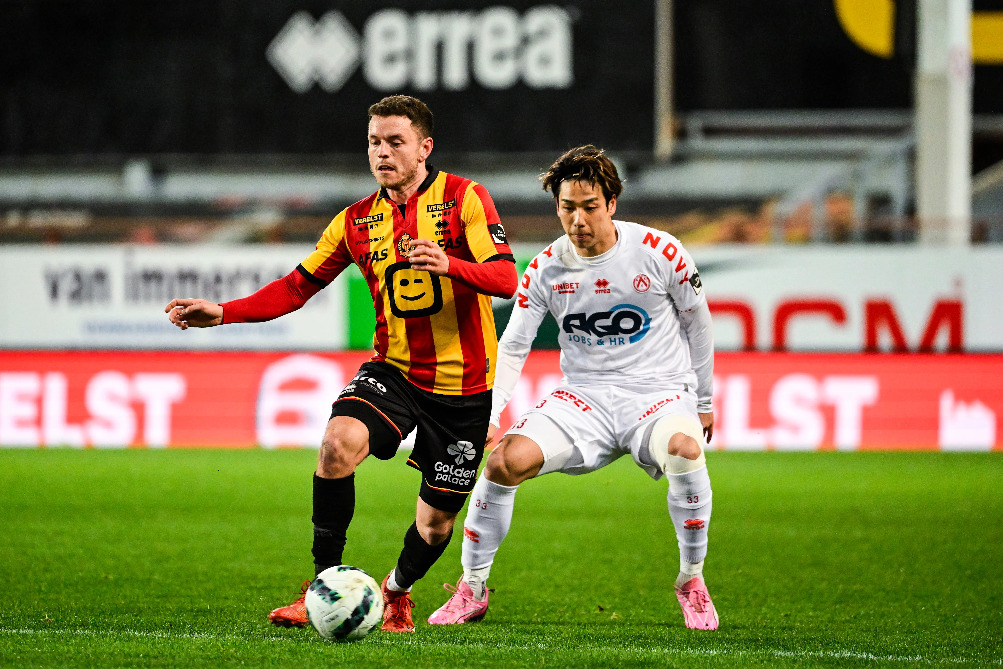 Mechelen's Kerim Mrabti and Kortrijk's Ryotaro Tsunoda pictured in action during a soccer match between KV Mechelen and KV Kortrijk, Saturday 24 February 2024 in Mechelen, on day 27 of the 2023-2024 season of the 'Jupiler Pro League' first division of the Belgian championship. BELGA PHOTO TOM GOYVAERTS