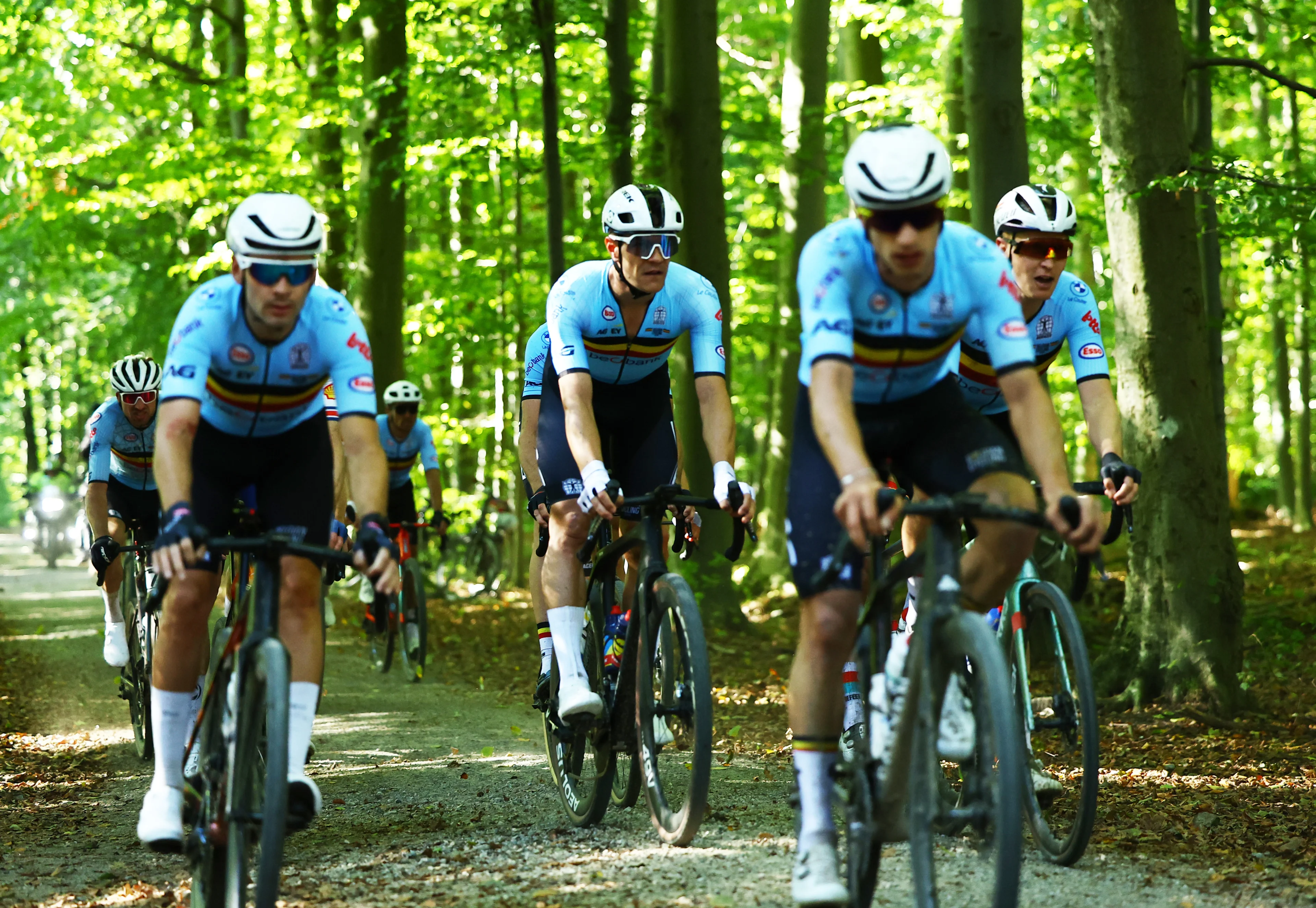 Belgian Jasper Stuyven (C) and Belgian Tim Merlier (R) pictured in action during the men elite race at the UCI World Gravel Championships, Sunday 06 October 2024, in Leuven. BELGA PHOTO DAVID PINTENS