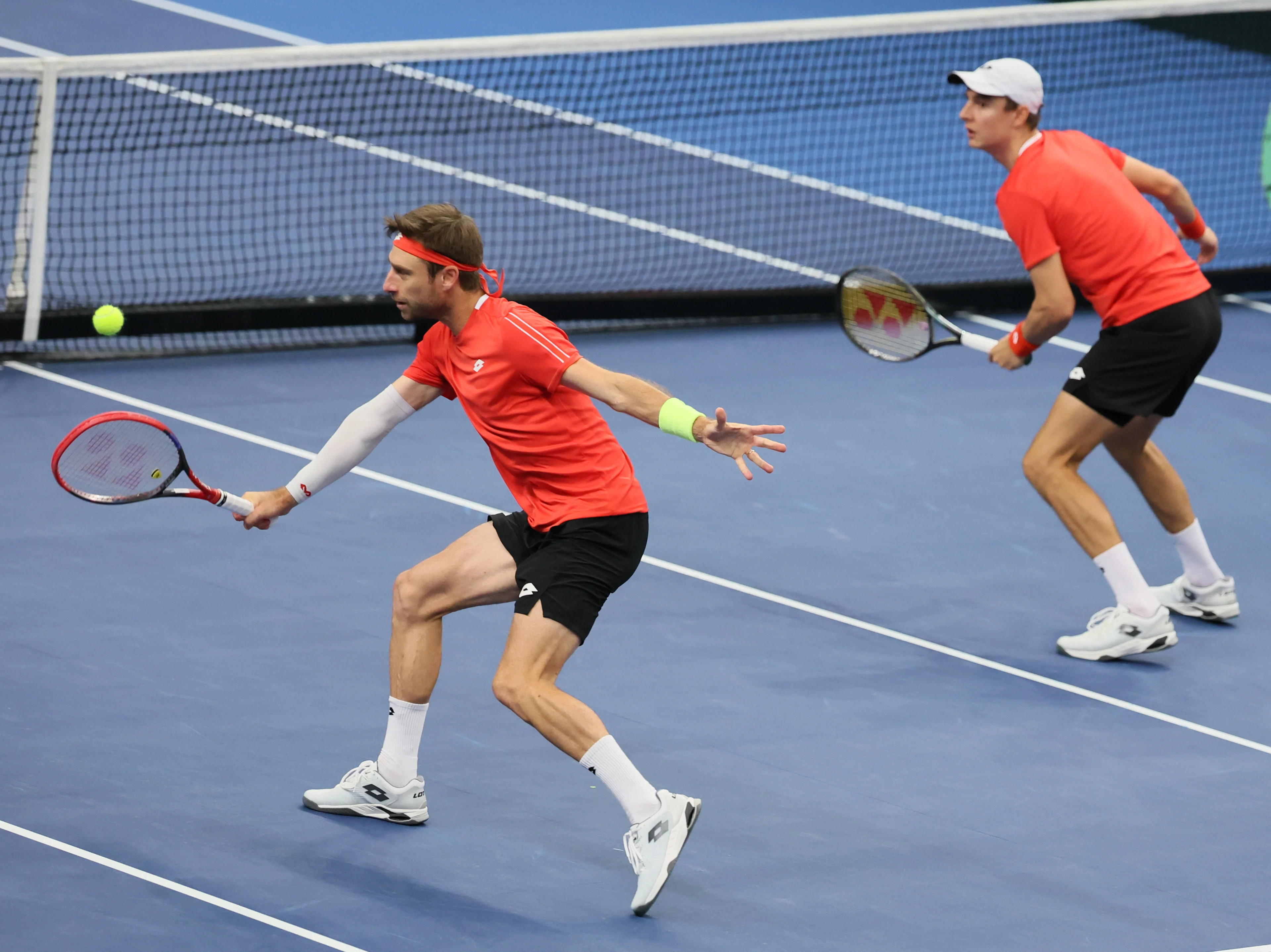 Belgian Sander Gille and Belgian Joran Vliegen pictured in action during a double game between Belgian pair Gille-Vliegen and Chilean pair Barrios Vera-Jarry, the third match in the Davis Cup qualifiers World Group tennis meeting between Belgium and Chile, Sunday 02 February 2025, in Hasselt. BELGA PHOTO BENOIT DOPPAGNE