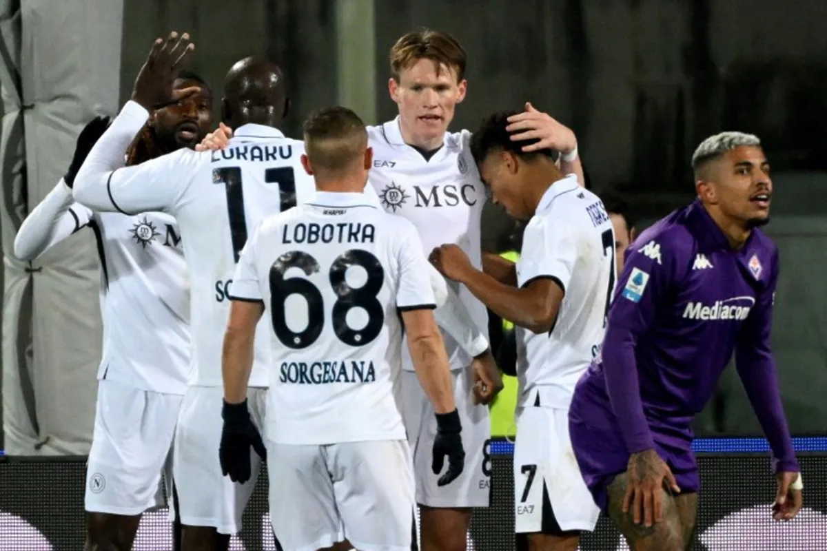 Napoli's Scottish midfielder #08 Scott Mc Tominay (C) celebrates after scoring his team's third goal during the Italian Serie A football match Fiorentina against Napoli, at Artemio Franchi stadium, in Florence on January 4, 2025.  Alberto PIZZOLI / AFP