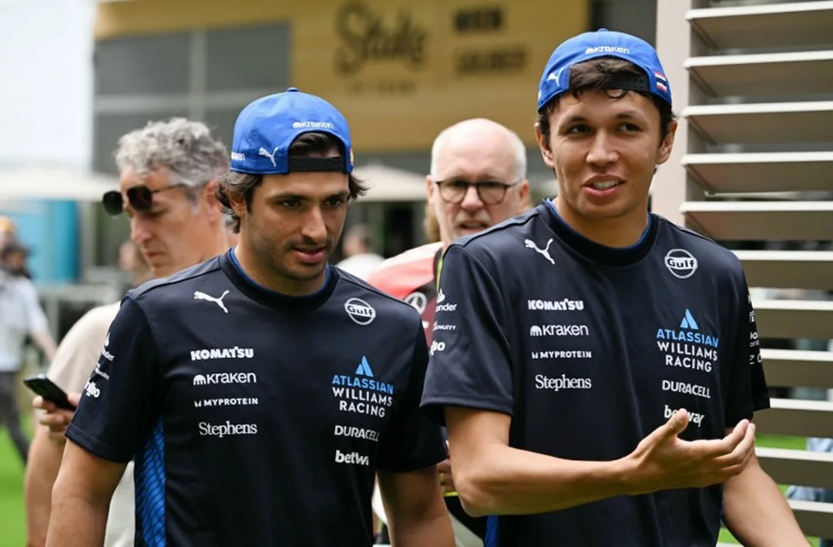 Williams' Spanish driver Carlos Sainz, Jr. (L), and teammate Thai driver Alexander Albon arrive ahead of the practice session for the 2025 Miami Formula One Grand Prix at Miami International Autodrome in Miami Gardens, Florida, on May 2, 2025. Chandan Khanna / AFP