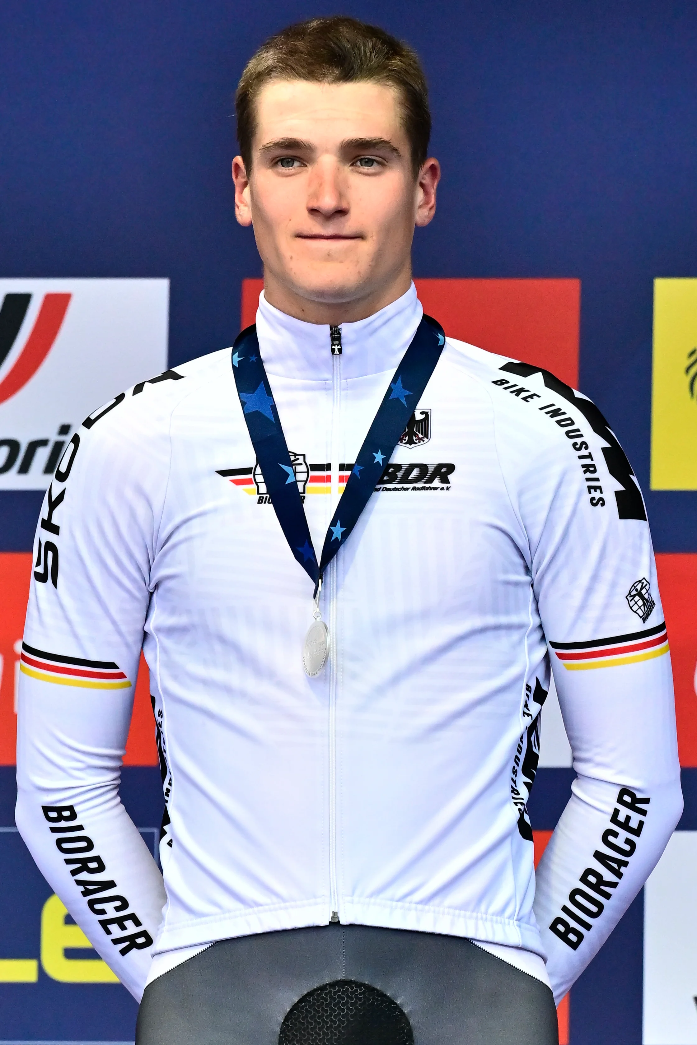 Silver medal winner German Niklas Behrens celebrates on the podium of the road race U23 Men at the European Championship 2024, in Hasselt, Friday 13 September 2024. The UEC Road European Championships 2024 will take place from 11 to 15 september in Limburg, Belgium. BELGA PHOTO DIRK WAEM