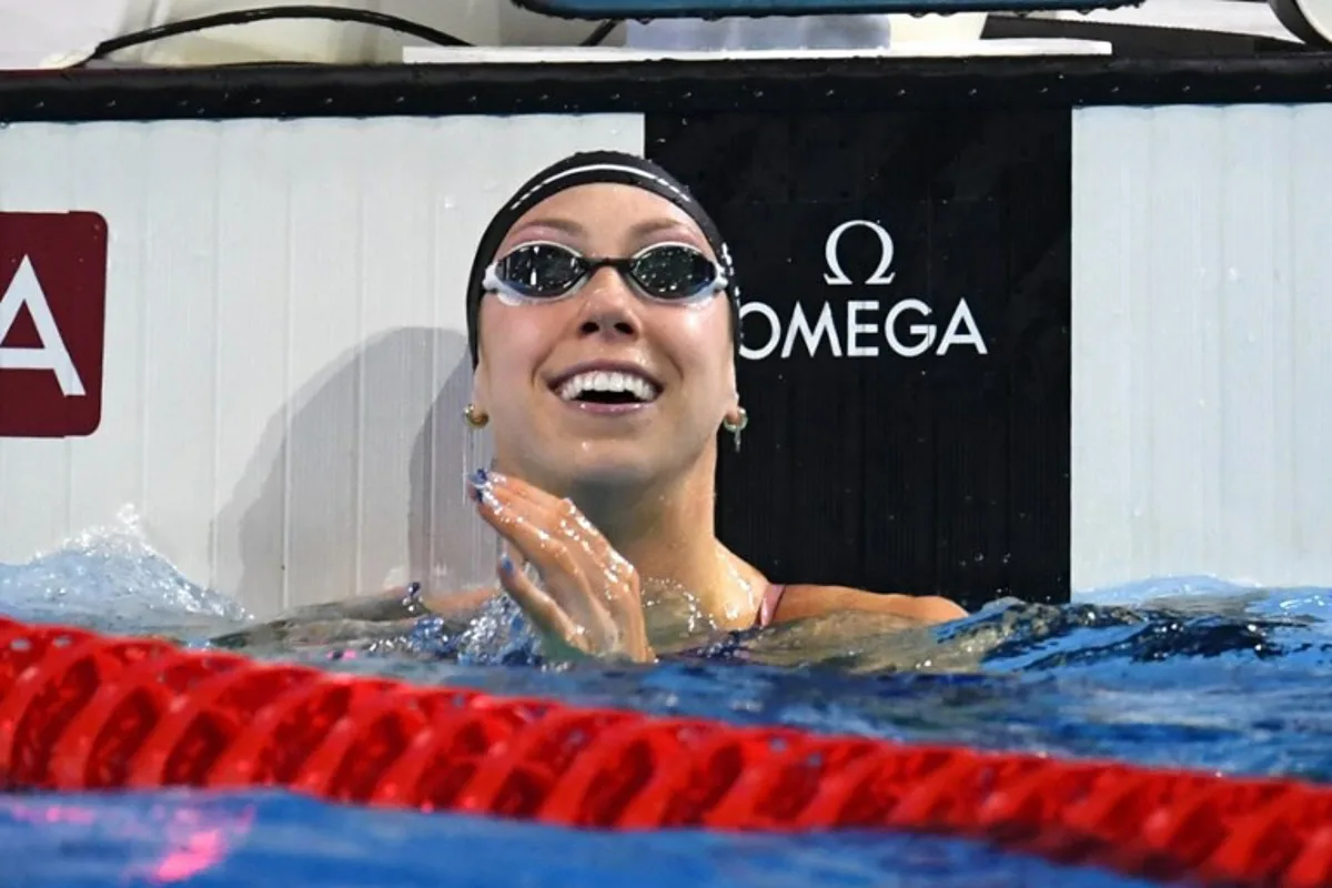 US Gretchen Walsh celebrates winning the Women's 50 meters Freestyle final during the World Aquatics Swimming Championships (25 m) 2024 at Duna Arena in Budapest, on December 15, 2024.   Ferenc ISZA / AFP