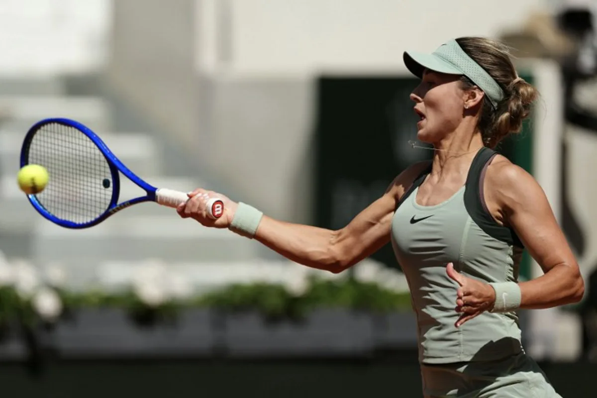 Anna Kalinskaya plays a forehand return to Austria's Anastasia Potapova during their women's singles match on day 9 of the French Open tennis tournament on Court Suzanne-Lenglen at the Roland-Garros Complex in Paris on June 1, 2026. Dimitar DILKOFF / AFP