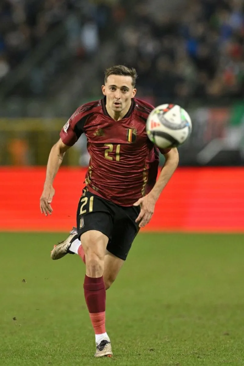 Belgium's defender #21 Timothy Castagne runs with the ball during the UEFA Nations League Group A2 football match between Belgium and Italy at the King Baudouin Stadium in Brussels on November 14, 2024.  NICOLAS TUCAT / AFP