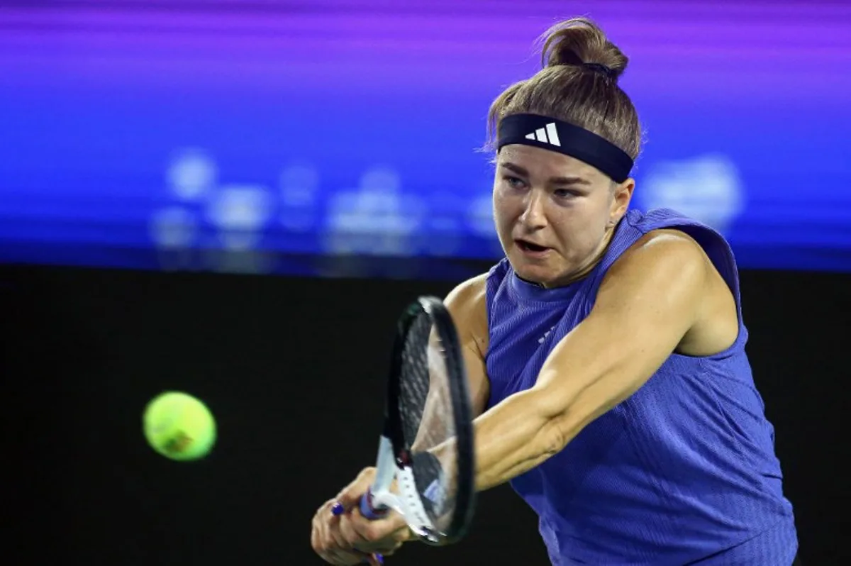 Czech Republic's Karolina Muchova hits a return to Russia's Mirra Andreeva during their women's singles semifinal match at the WTA Ningbo Open tennis tournament in Ningbo, in eastern China's Zhejiang province on October 19, 2024.  AFP