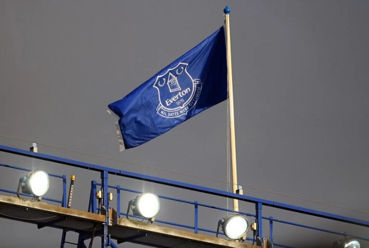 An Everton flag flies on the roff of the stands ahead of the English Premier League football match between Everton and Aston Villa at Goodison Park in Liverpool, north west England on May 1, 2021.  Michael Regan / POOL / AFP RESTRICTED TO EDITORIAL USE. No use with unauthorized audio, video, data, fixture lists, club/league logos or 'live' services. Online in-match use limited to 120 images. An additional 40 images may be used in extra time. No video emulation. Social media in-match use limited to 120 images. An additional 40 images may be used in extra time. No use in betting publications, games or single club/league/player publications.

