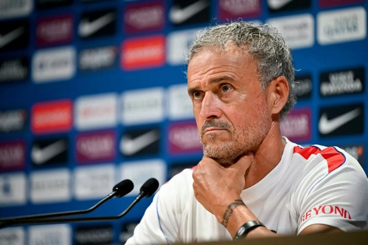 PSG's Spanish headcoach Luis Enrique looks on as he delivers a press conference following a training session at the Paris Saint-Germain's campus in Poissy, west of Paris on August 15, 2026, on the eve of their French Super Cup (Trophee des Champions) football match against RC Lens.  LOU BENOIST / AFP