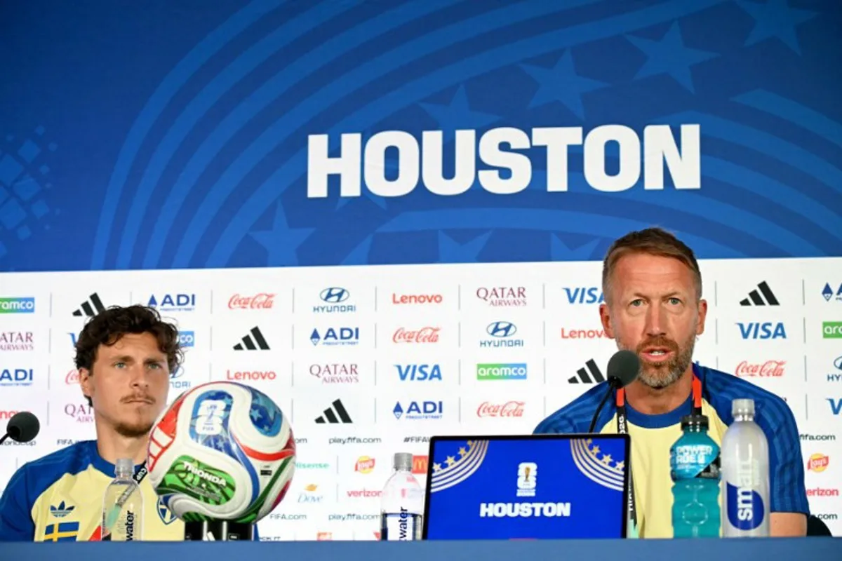 Sweden's English head coach Graham Potter (R) and defender #03 Victor Lindelof (L) give an MD-1 press conference at the Houston Stadium in Houston on June 19, 2026, on the eve of the 2026 World Cup Group F football match between the Netherlands and Sweden. RONALDO SCHEMIDT / AFP