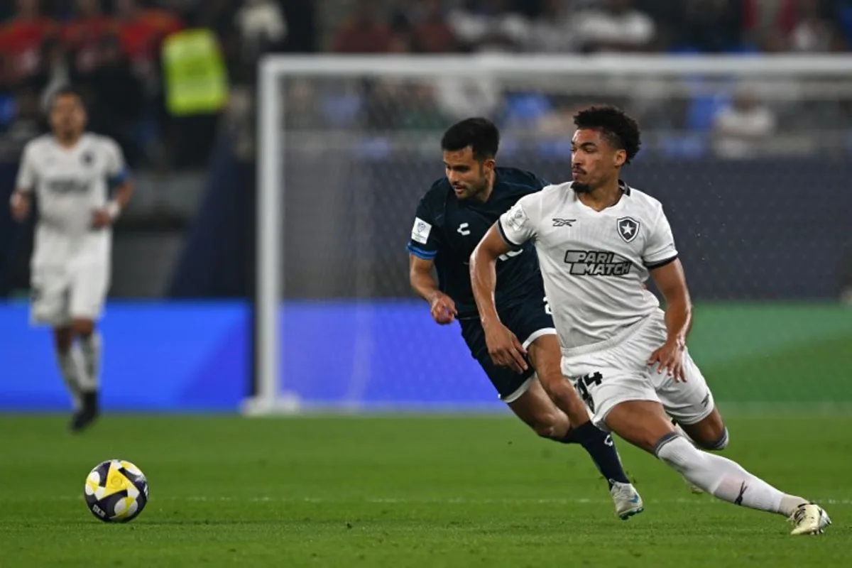 Botafogo's Brazilian defender #34 Adryelson is marked by Pachuca's Mexican midfielder #26 Alan Bautista during the 2024 FIFA Intercontinental Cup football match between Brazil's Botafogo and Mexico's Pachuca at Stadium 974 in Doha on December 11, 2024.  Mahmud HAMS / AFP