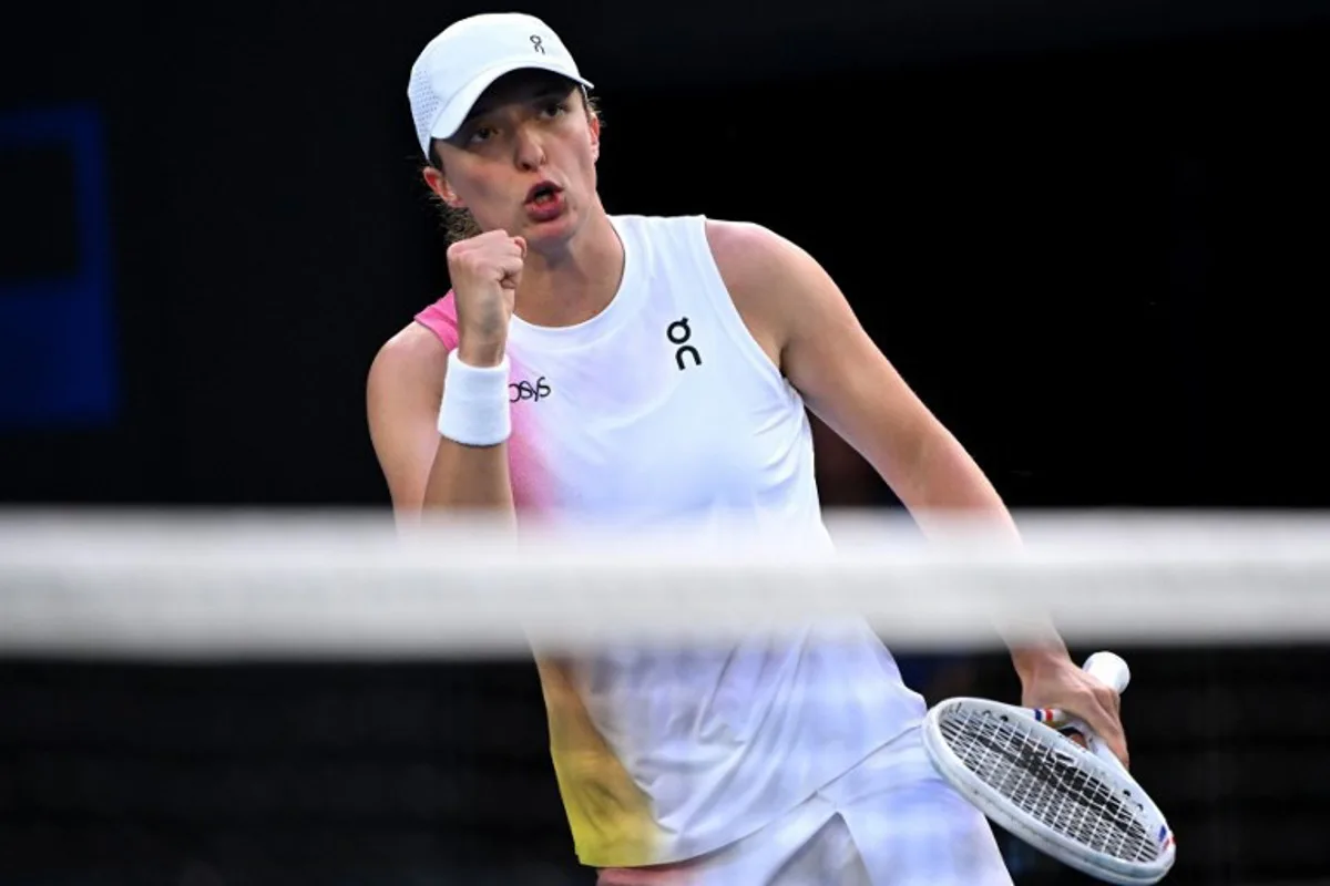 Poland's Iga Swiatek reacts on a point against Germany's Eva Lys during their women's singles match on day nine of the Australian Open tennis tournament in Melbourne on January 20, 2025.  WILLIAM WEST / AFP