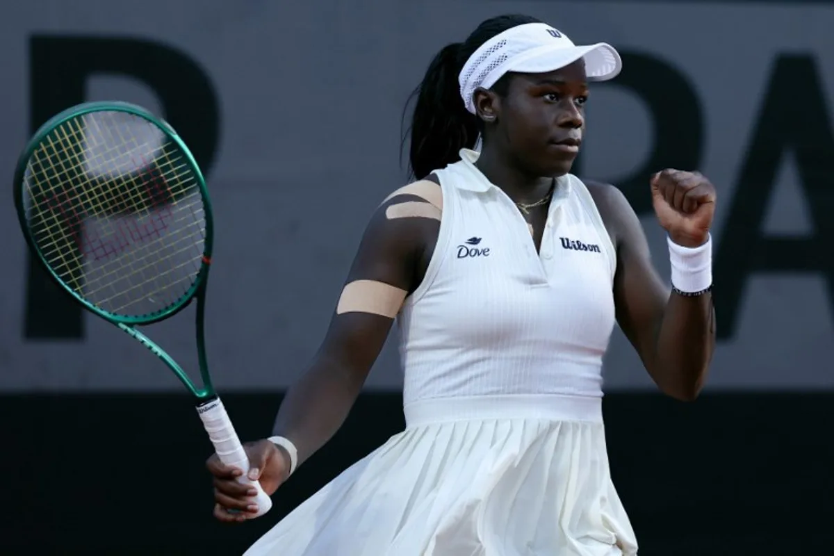 Canada's Victoria Mboko celebrates her victory against Czech Republic's Nikola Bartunkova at the end of their women's singles match on day 3 of the French Open tennis tournament at the Roland-Garros Complex in Paris on May 26, 2026.  Alain JOCARD / AFP