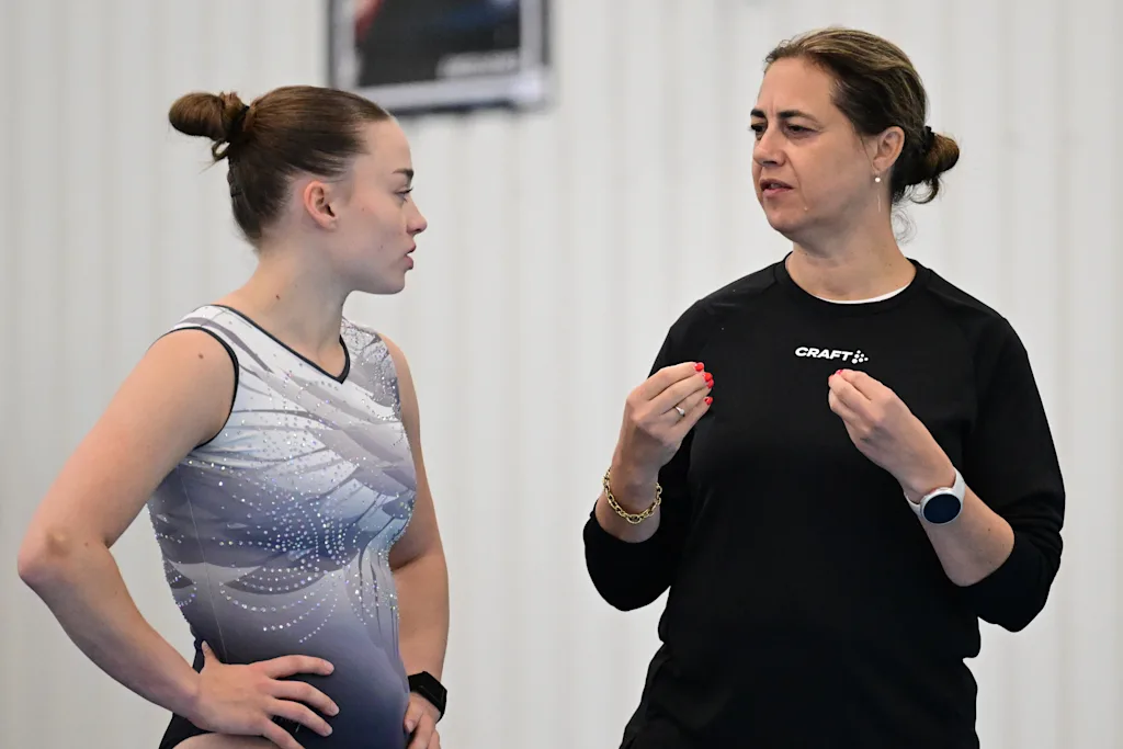 Belgian gymnast Jade Vansteenkiste and coach Valerie Van Cauwenberghe pictured during a training session of Belgium's artistic gymnastics team, Wednesday 7 October 2026, in Gent, ahead of the Worlds Championships in Rotterdam from 17 to 25 October 2026. BELGA PHOTO DIRK WAEM