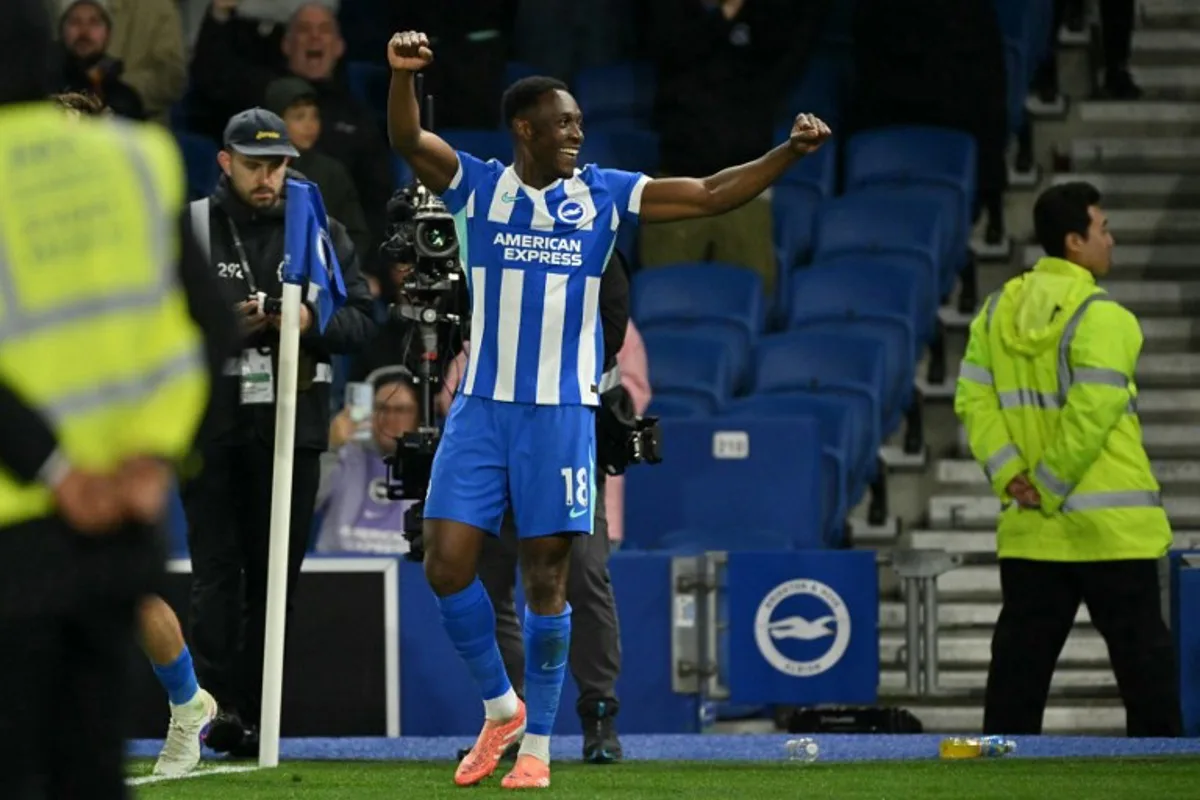 Brighton's English striker #18 Danny Welbeck celebrates after scoring their third goal during the English Premier League football match between Brighton and Hove Albion and Chelsea at the American Express Community Stadium in Brighton, southern England on April 21, 2026.  Glyn KIRK / AFP