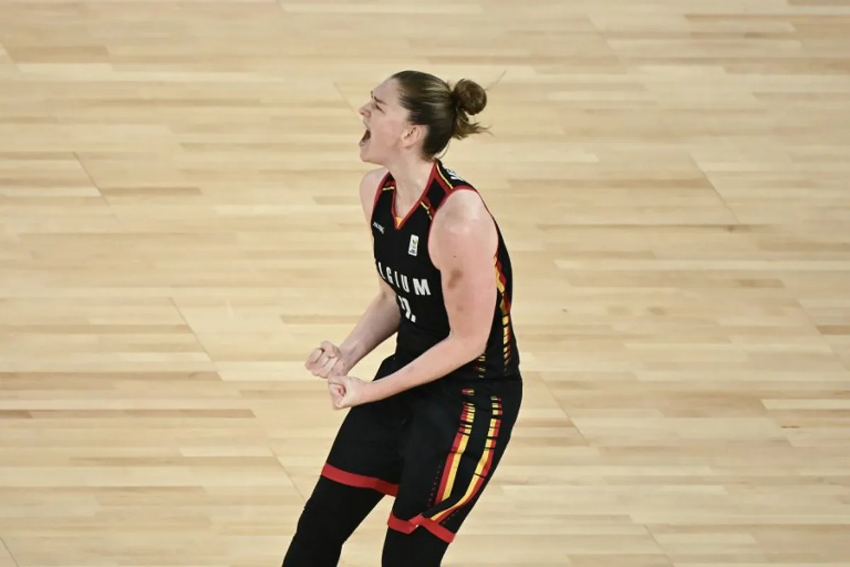 Belgium's #11 Emma Meesseman reacts in the women's semifinal basketball match between France and Belgium during the Paris 2024 Olympic Games at the Bercy Arena in Paris on August 9, 2024.  Aris MESSINIS / AFP