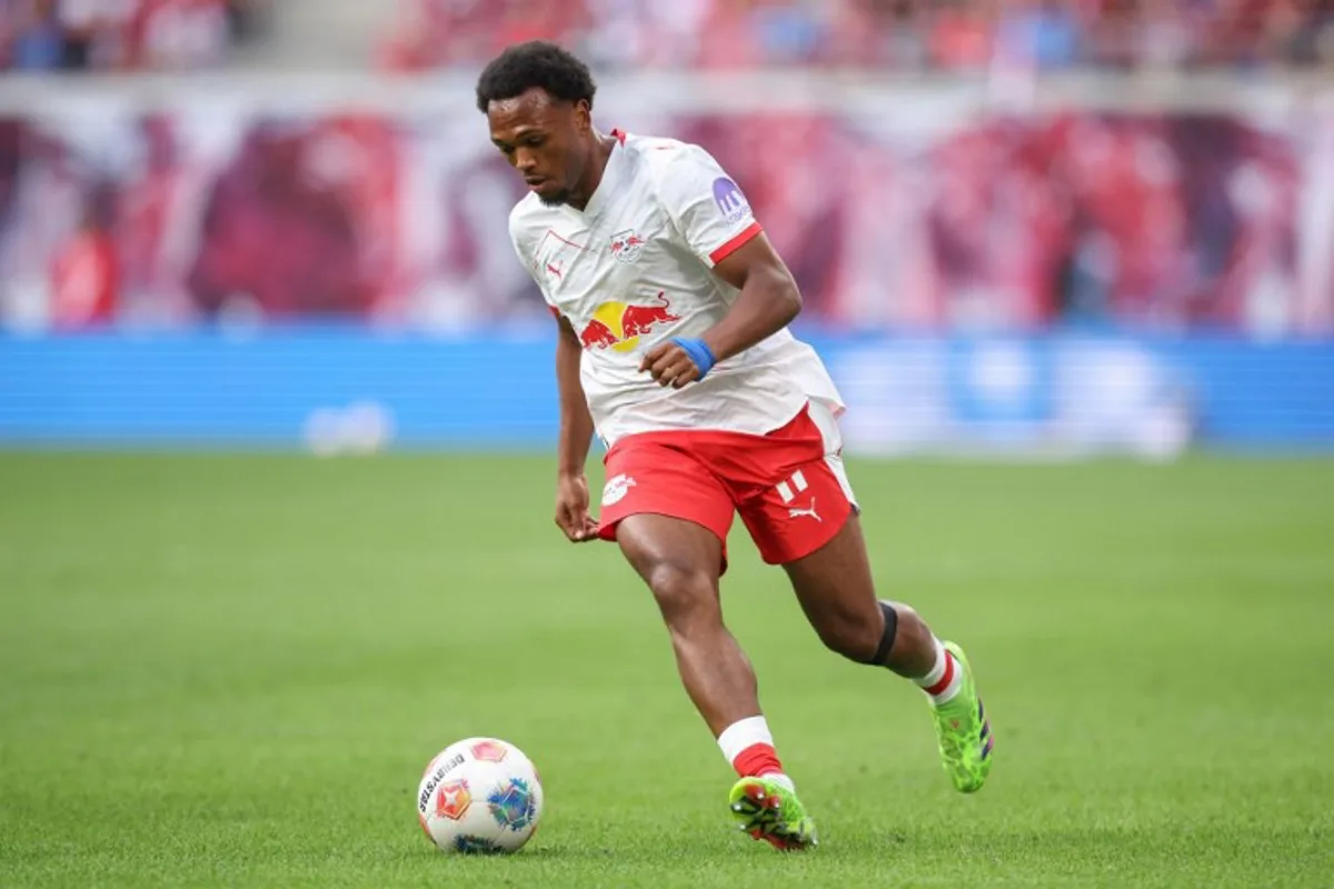 Leipzig's Belgian forward #11 Lois Openda runs with the ball during the German first division Bundesliga football match between RB Leipzig and 1. FC Heidenheim 1846 in Leipzig on August 30, 2025. Ronny HARTMANN / AFP