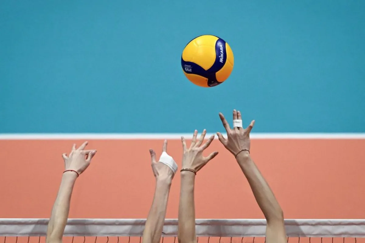 China's players attempt to block a ball in the women's gold medal volleyball event against Japan during the Hangzhou 2022 Asian Games in Hangzhou, in China's eastern Zhejiang province on Octorber 7, 2023.  WANG Zhao / AFP