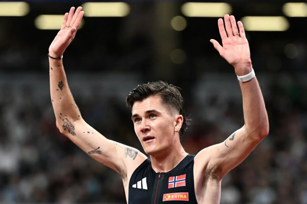 Norway's Jakob Ingebrigtsen reacts after competing in the men's 5000m heats during the World Athletics Championships in Tokyo on September 19, 2025. Jewel SAMAD / AFP