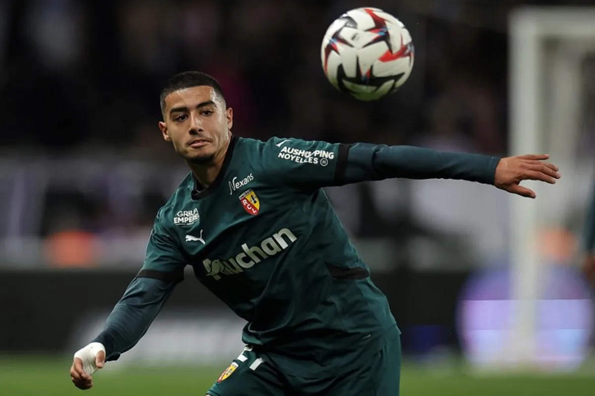 Lens' Moroccan forward #21 Anass Zaroury eyes the ball during the French L1 football match between Toulouse FC and RC Lens at The TFC Stadium in Toulouse, southwestern France, on May 10, 2025. Valentine CHAPUIS / AFP