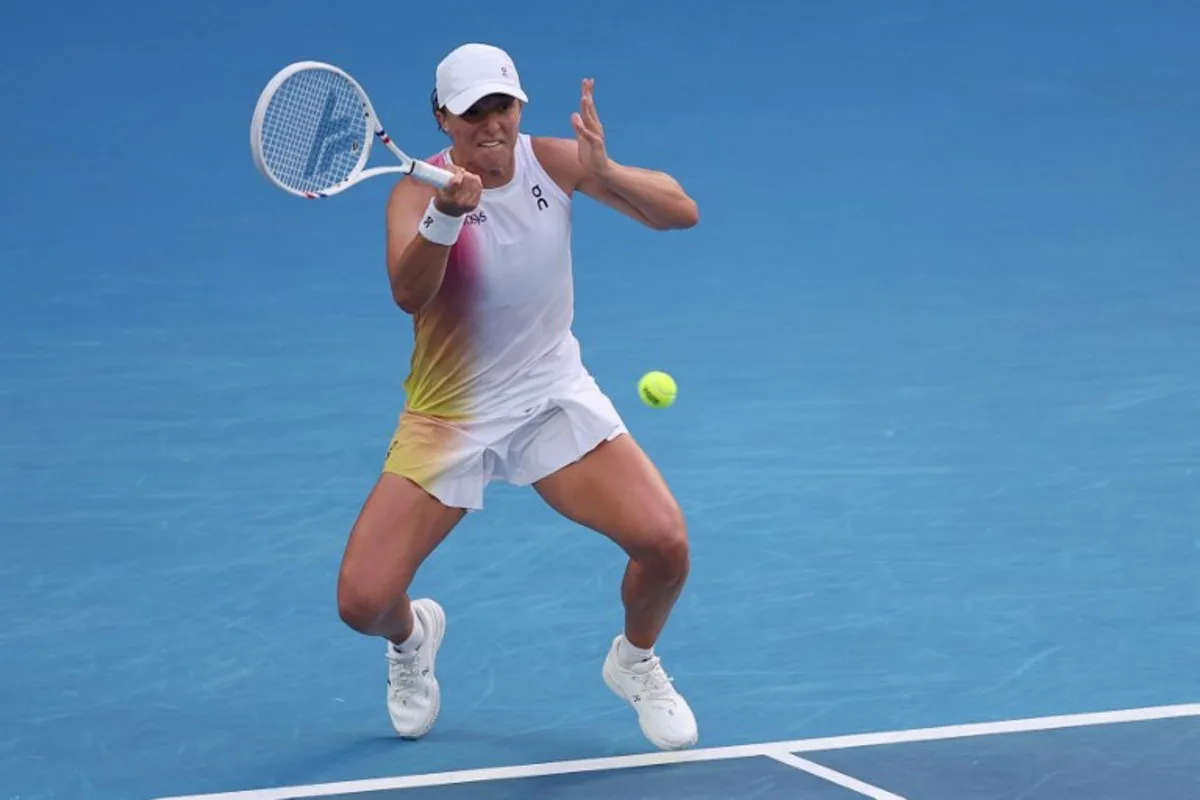 Poland's Iga Swiatek hits a return against Germany's Eva Lys during their women's singles match on day nine of the Australian Open tennis tournament in Melbourne on January 20, 2025.  Martin KEEP / AFP