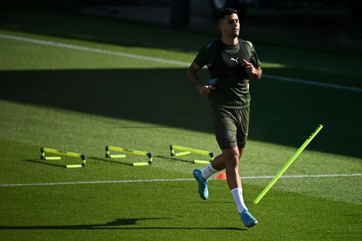 Manchester City's Spanish midfielder #16 Rodri takes part in a team training session at Manchester City's training ground, in Manchester, north-west England, on September 17, 2024, on the eve of their UEFA Champions League football match against Inter Milan.   Oli SCARFF / AFP