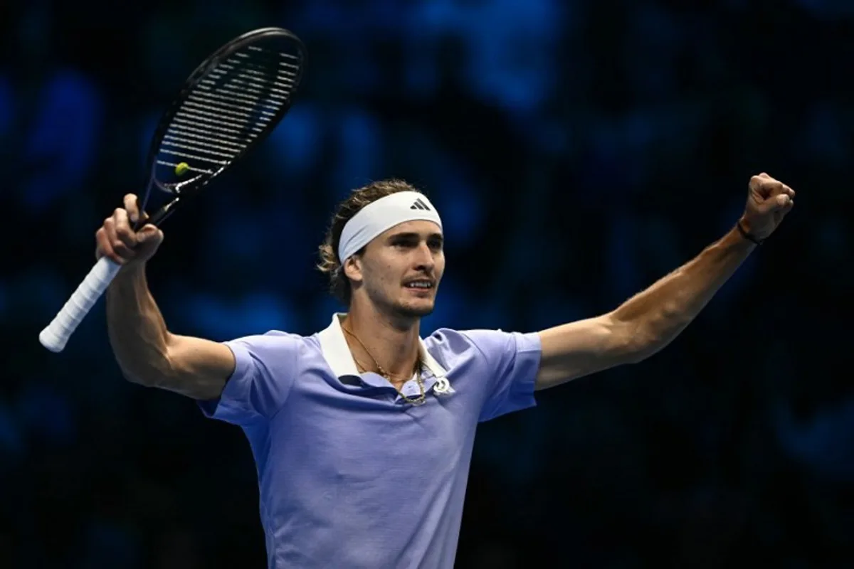 Germany's Alexander Zverev celebrates after winning the first set against Spain's Carlos Alcaraz during their match at the ATP Finals tennis tournament in Turin on November 15, 2024.  Marco BERTORELLO / AFP