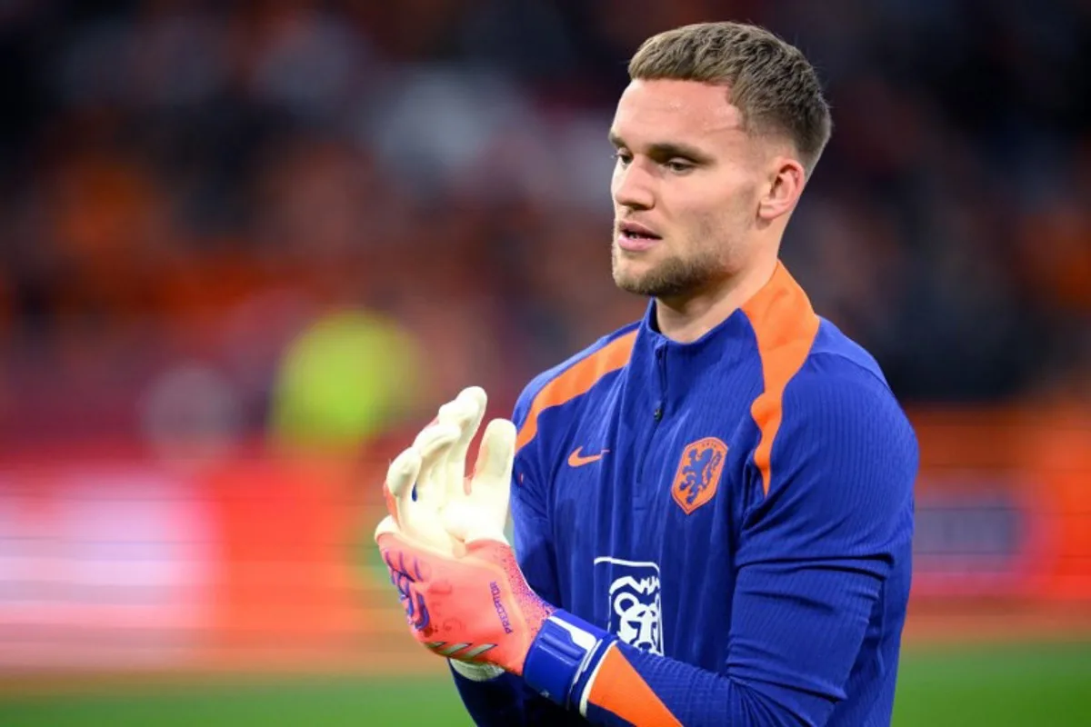 Netherlands' goalkeeper Bart Verbruggen looks on during warm up prior to the FIFA World Cup 2026 Group G European qualification football match between the Netherlands and Lithuania at the Johan Cruijff Arena, in Amsterdam, on November 17, 2025. JOHN THYS / AFP