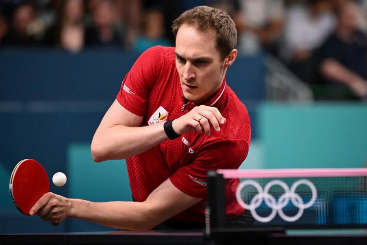 Belgium's Cedric Nuytinck plays a return against Sweden's Truls Moregard during their men's table tennis singles round of 64 at the Paris 2024 Olympic Games at the South Paris Arena in Paris on July 27, 2024. JUNG Yeon-je / AFP
