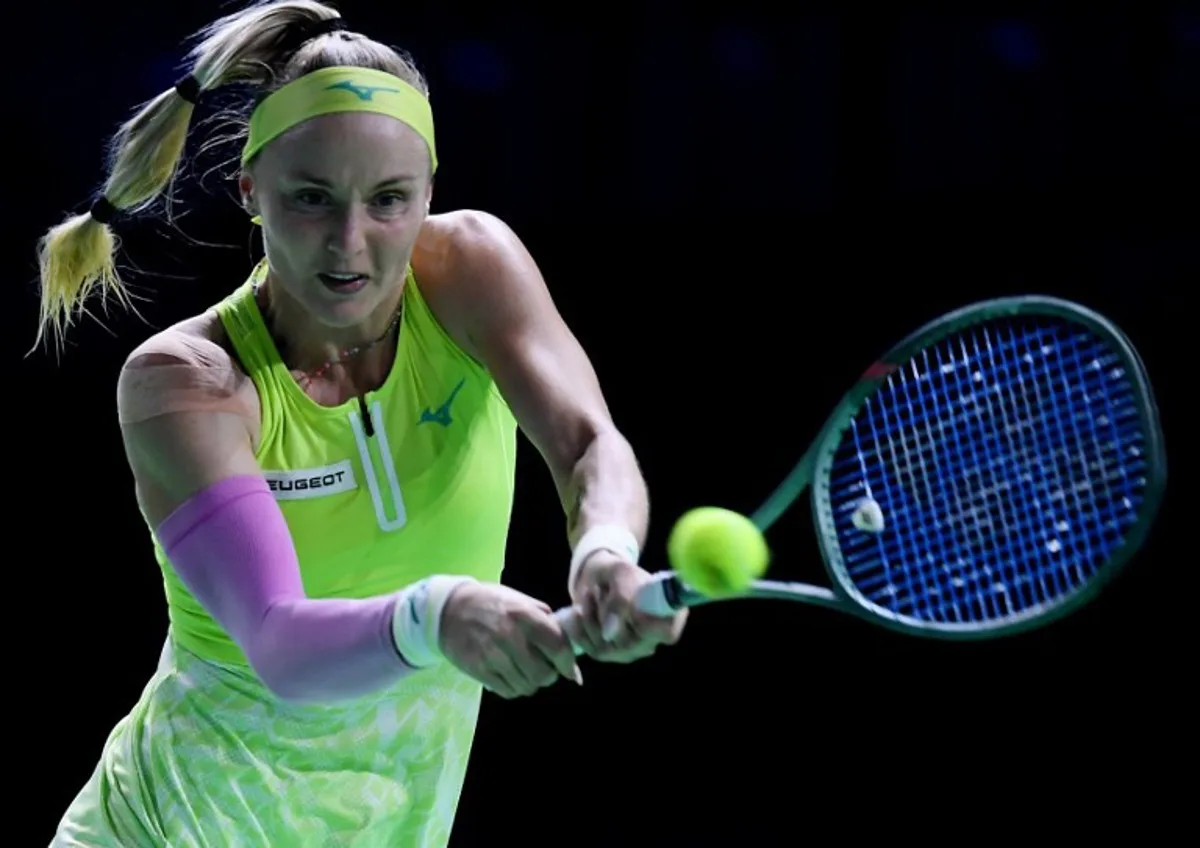 Slovakia's Rebecca Sramkova returns the ball against US' Danielle Collins during their singles tennis match between Slovakia and USA at the Billie Jean King Cup Finals at the Palacio de Deportes Jose Maria Martin Carpena in Malaga, Spain, on November 14, 2024.   JORGE GUERRERO / AFP