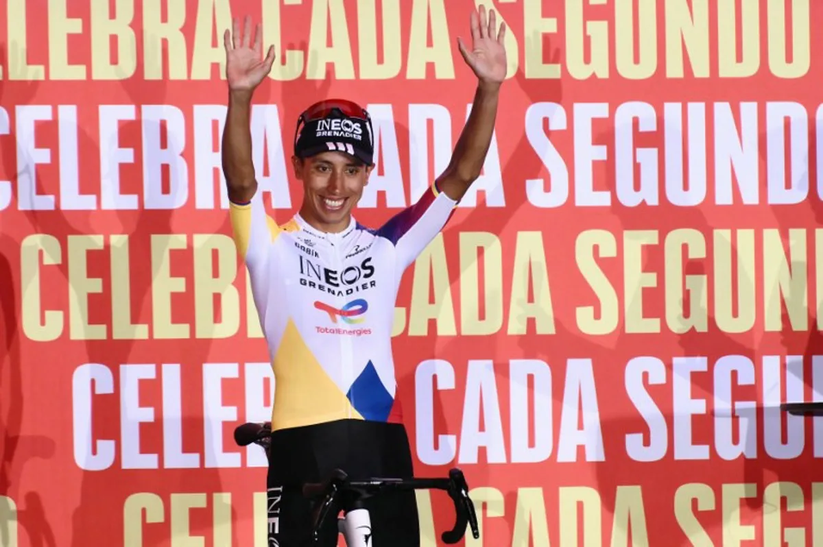 Team Ineos' Colombian rider Egan Bernal waves during the official teams presentation of the 80th edition of 'La Vuelta' cycling tour of Spain, in Torino, Italy on August 21, 2025. Marco BERTORELLO / AFP
