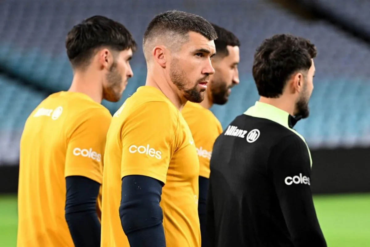 Australia's goalkeeper Matthew Ryan walks onto the field during a training session at Accor Stadium in Sydney on March 26, 2026, ahead of their FIFA series 2026 football match against Cameroon. SAEED KHAN / AFP