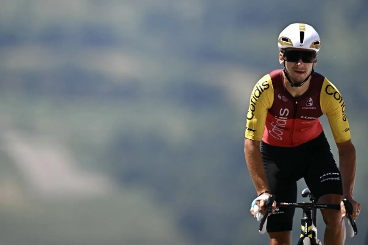 Cofidis team's French rider Bryan Coquard cycles to the finish line of the 13th stage of the 112th edition of the Tour de France cycling race, 10.9 km individual time trial between Loudenvielle and Peyragudes, in the Pyrenees mountains of southwestern France, on July 18, 2025. Loic VENANCE / AFP