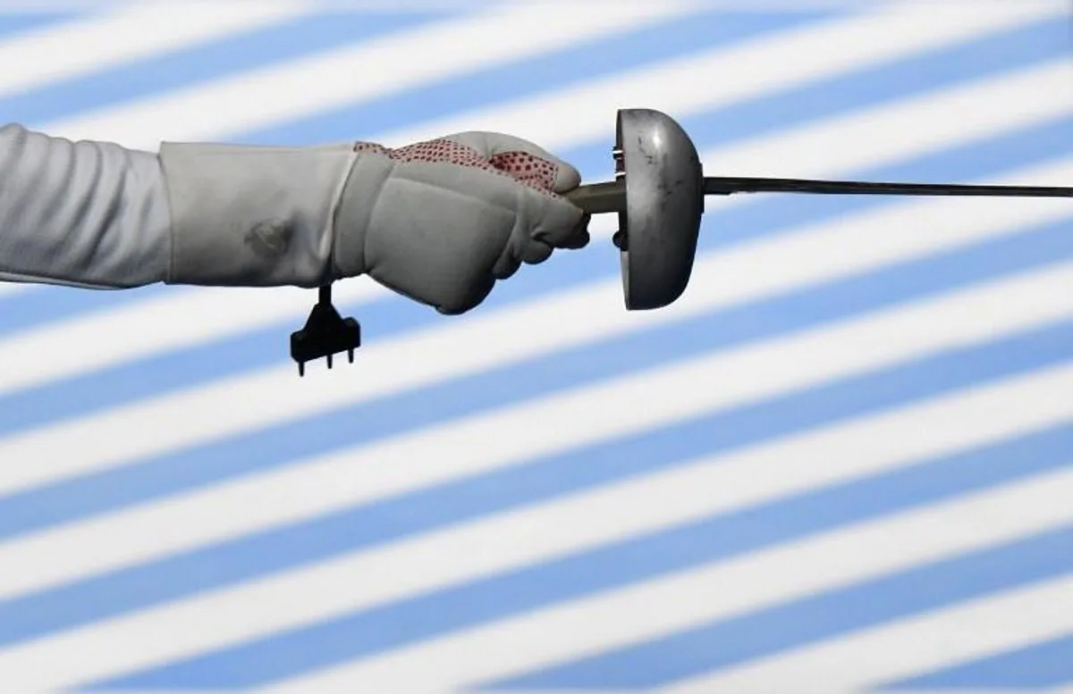 Venezuela's Silvio Fernandez competes during  the men¿s team epee qualifying bout between  Brazil and Venezuela as part of the fencing event of the Rio 2016 Olympic Games, on August 14, 2016, at the Carioca Arena 3, in Rio de Janeiro.  Kirill KUDRYAVTSEV / AFP