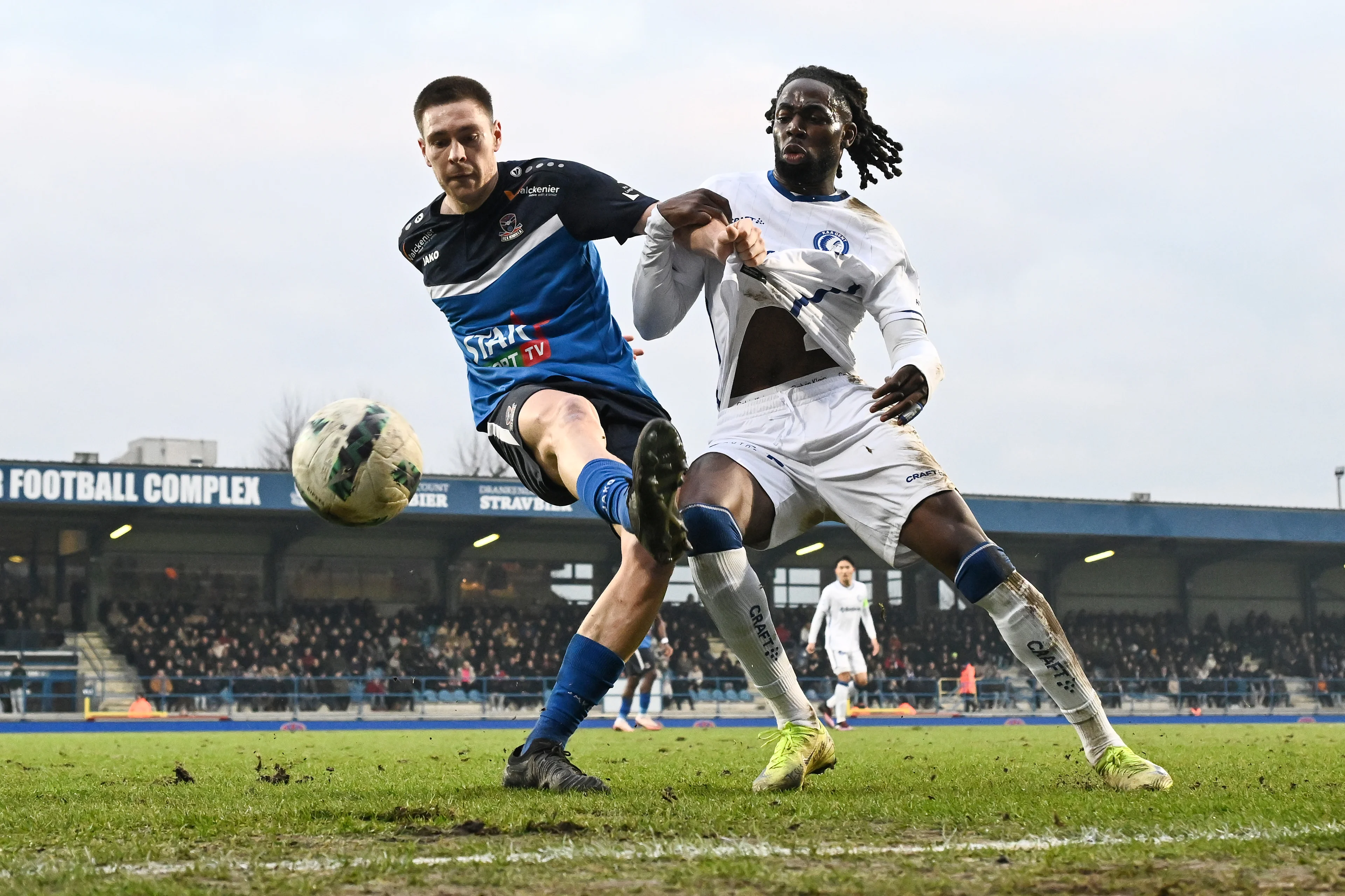 Dender's Aurelien Scheidler and Gent's Jordan Torunarigha fight for the ball during a soccer match between FCV Dender EH and KAA Gent, Sunday 12 January 2025 in Denderleeuw, on day 21 of the 2024-2025 season of the 'Jupiler Pro League' first division of the Belgian championship. BELGA PHOTO MAARTEN STRAETEMANS