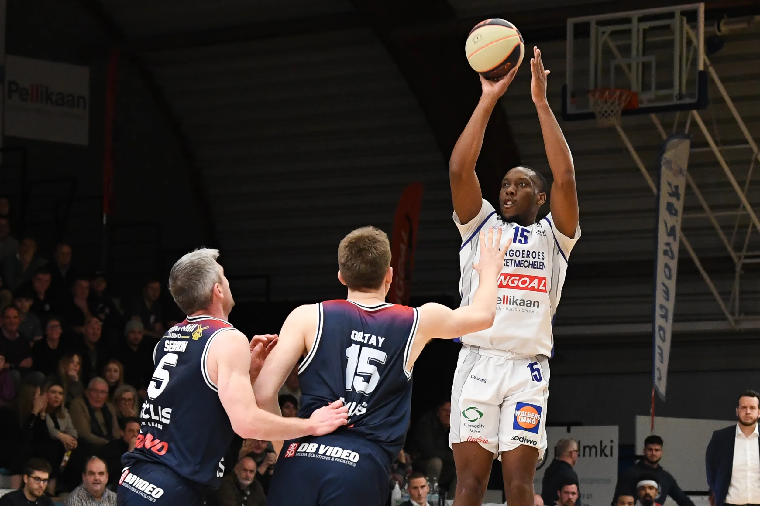 Limburg's Quentin Serron, Limburg's Oskar Giltay and Mechelen's Aundre Hyatt pictured in action during a basketball match between Kangoeroes Mechelen and Limburg United, Thursday 26 December 2024 in Mechelen, on day 17 of the 'BNXT League' Belgian/ Dutch first division basket championship. BELGA PHOTO JILL DELSAUX