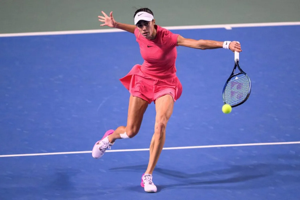 Serbia's Olga Danilovic hits a return to Czech Republic's Katerina Siniakova during their women's singles semifinal match at the Guangzhou Open tennis tournament in Guangzhou, China's southern Guangdong province on October 26, 2024.   STR / AFP