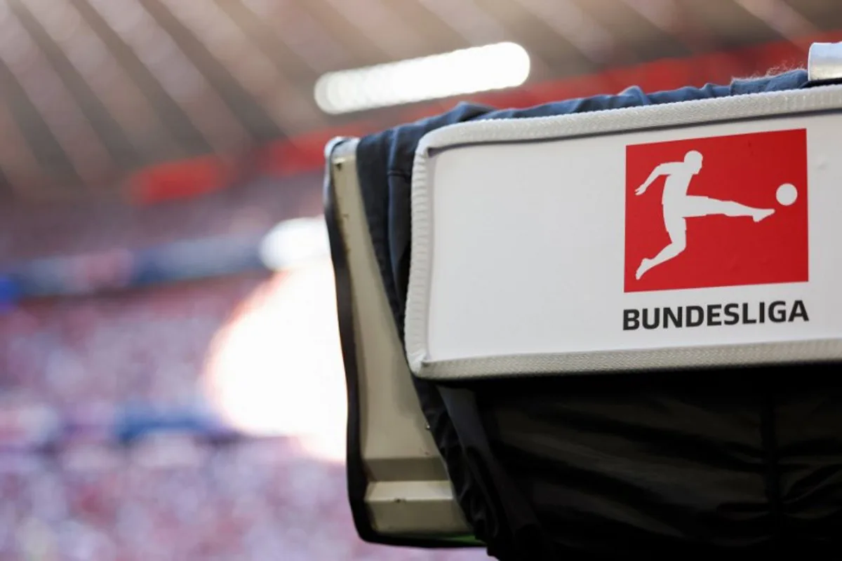 A TV camera with the Bundesliga logo is pictured during German first division Bundesliga football match between FC Bayern Munich and VfL Wolfsburg in Munich, southern Germany on May 12, 2024. Michaela STACHE / AFP