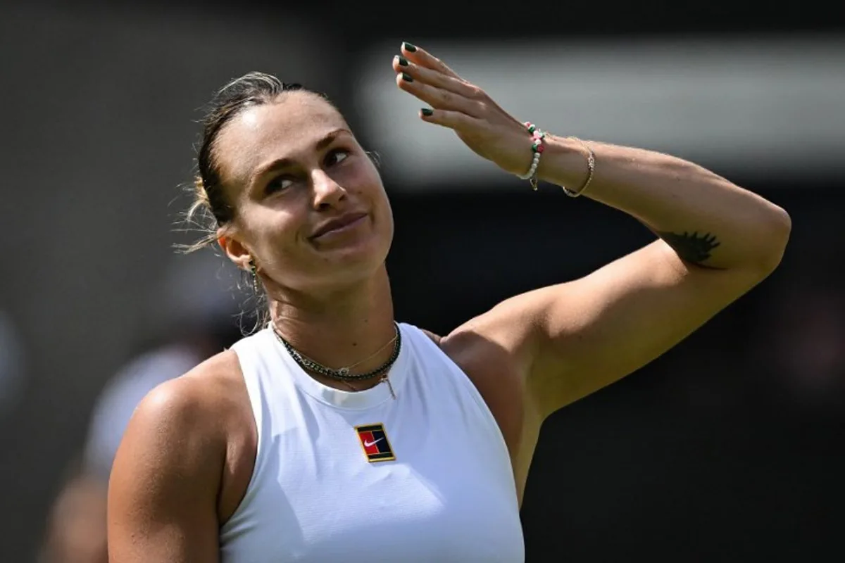 Belarus's Aryna Sabalenka celebrates after winning against Czech Republic's Marie Bouzkova at the end of their women's singles second round tennis match on the third day of the 2025 Wimbledon Championships at The All England Lawn Tennis and Croquet Club in Wimbledon, southwest London, on July 2, 2025. Kirill KUDRYAVTSEV / AFP