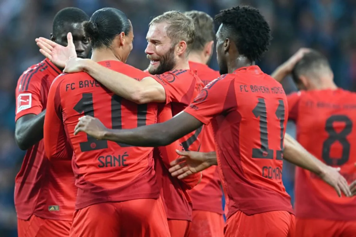 Bayern Munich's German forward #10 Leroy Sane celebrates scoring the 0-4 goal with his teammates during the German first division Bundesliga football match between VfL Bochum and FC Bayern Munich in Bochum, western Germany, on October 27, 2024.  INA FASSBENDER / AFP