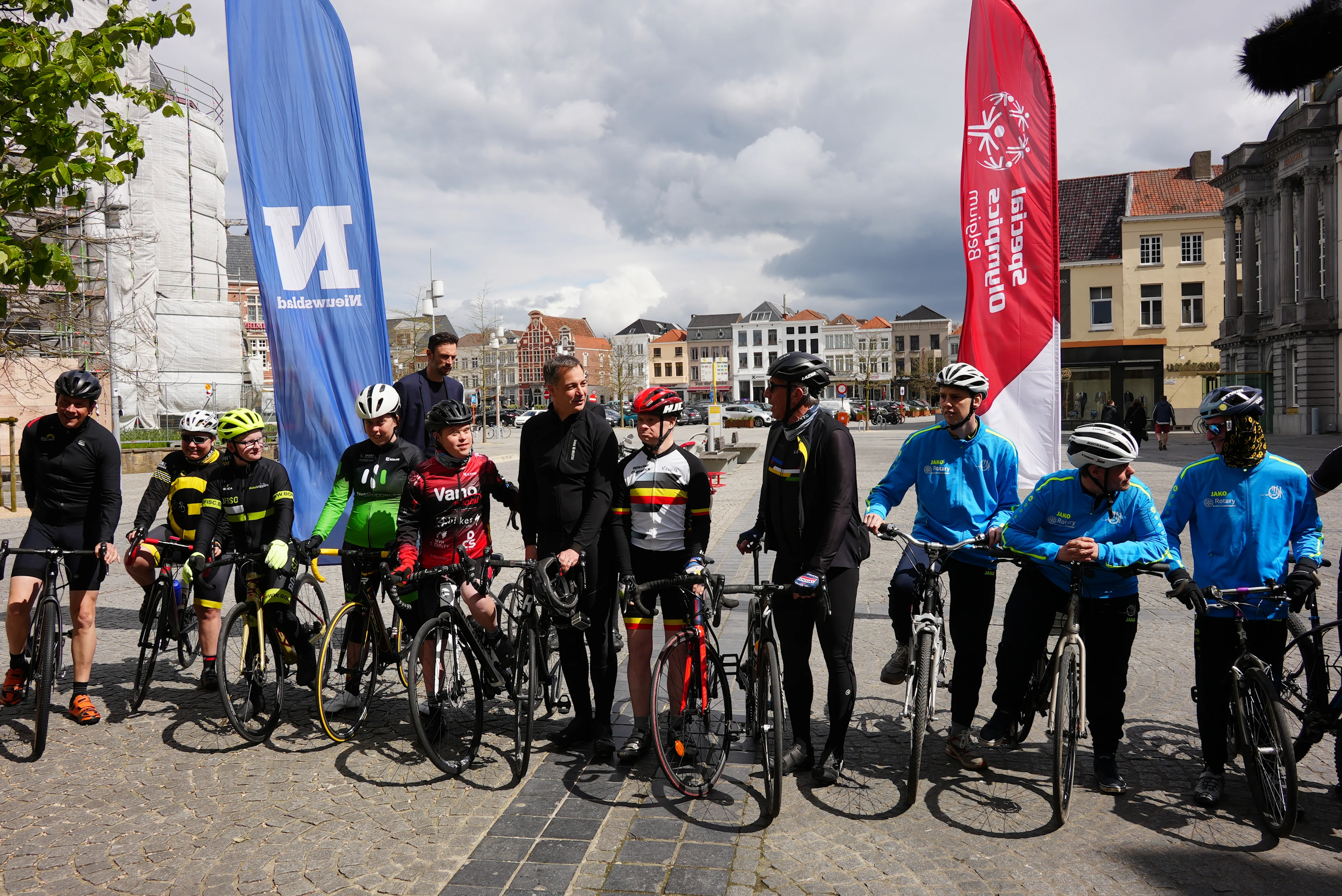 Participants and Prime Minister Alexander De Croo pictured during a press conference of Special Olympics, Flanders Classics, Golazo and Het Nieuwsblad to integrate races for people with intellectual disabilities into existing cycling races of various disciplines, in Oudenaarde, Tuesday 25 April 2023. The various partners explain the new initiative. After the general explanation, athletes from Special Olympics Belgium, together with the prime minister and some well-known cyclists, hoist themselves on their bicycle saddles for a first joint ride through Oudenaarde. BELGA PHOTO JONAS D'HOLLANDER