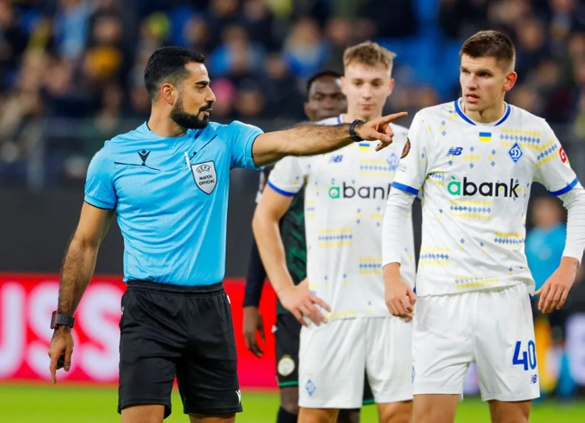 Swedish referee Referee Mohammed Al-Hakim gestures during the UEFA Europa League football match between Dynamo Kiev and Ferencvaros in Hamburg, on November 7, 2024. FRANK MOLTER / AFP