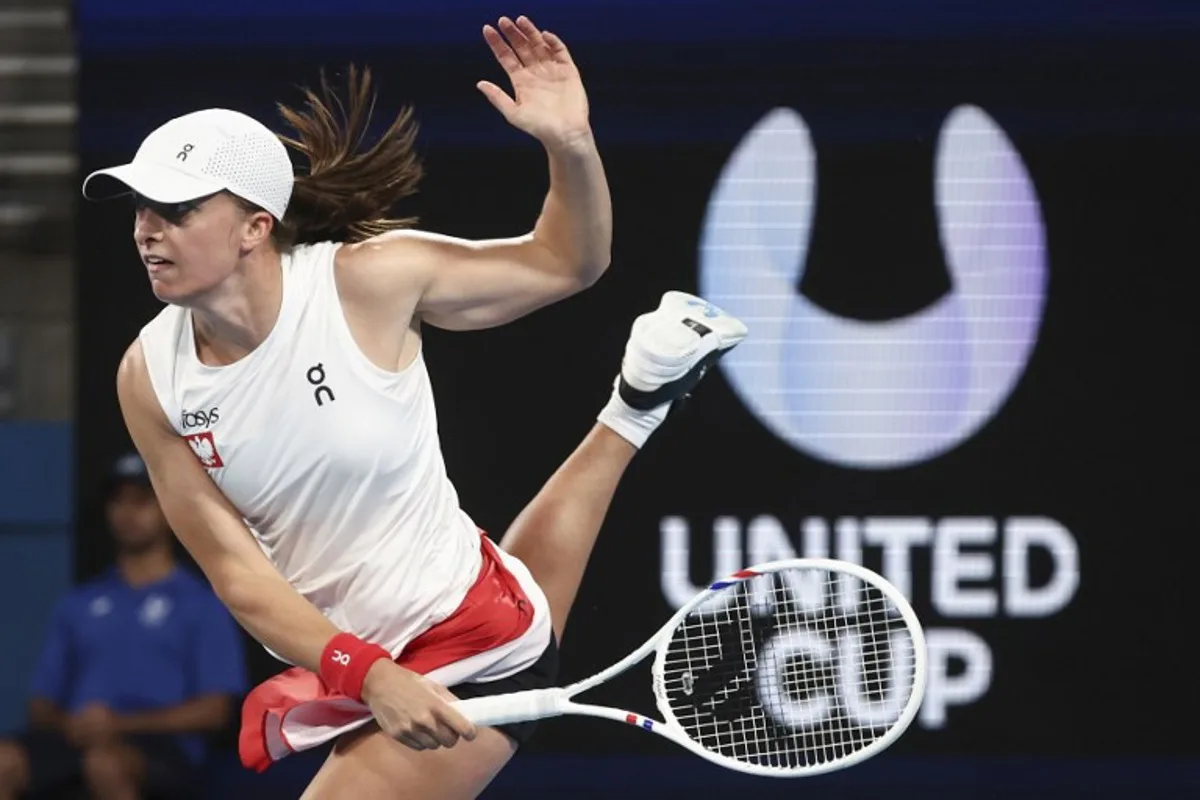 Poland's Iga Swiatek serves against Britain's Katie Boulter during their women's singles match at the United Cup tennis tournament on Ken Rosewall Arena in Sydney on January 2, 2025.  DAVID GRAY / AFP