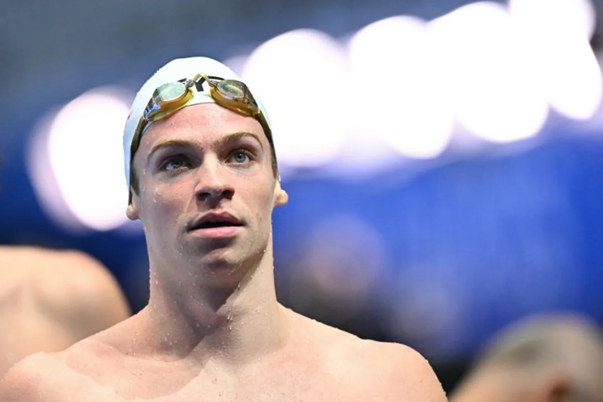 France's swimmer Leon Marchand reacts after a heat of the men's 400m individual medley swimming event during the 2025 World Aquatics Championships in Singapore on August 3, 2025. MANAN VATSYAYANA / AFP
